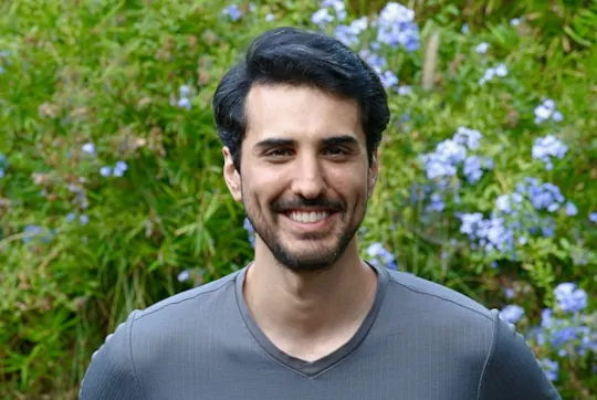 Photo of Kamran Eshtehardi, Ph.D. smiling.